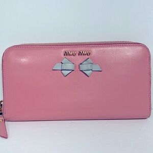 MiuMiu Wallet long ribbon zip around Pink leather blue leather ribbon on front.